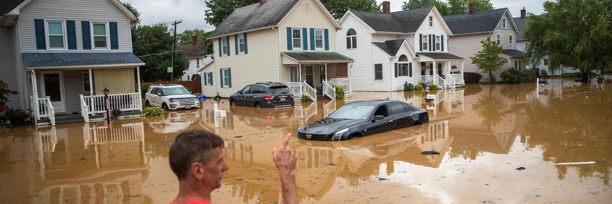 An evacuated resident points in the direction of his home following a flash flood, which came as Tropical Storm Henri made landfall, in Helmetta, New Jersey on August 22, 2021. (Photo: Tom Brenner/AFP via Getty Images)