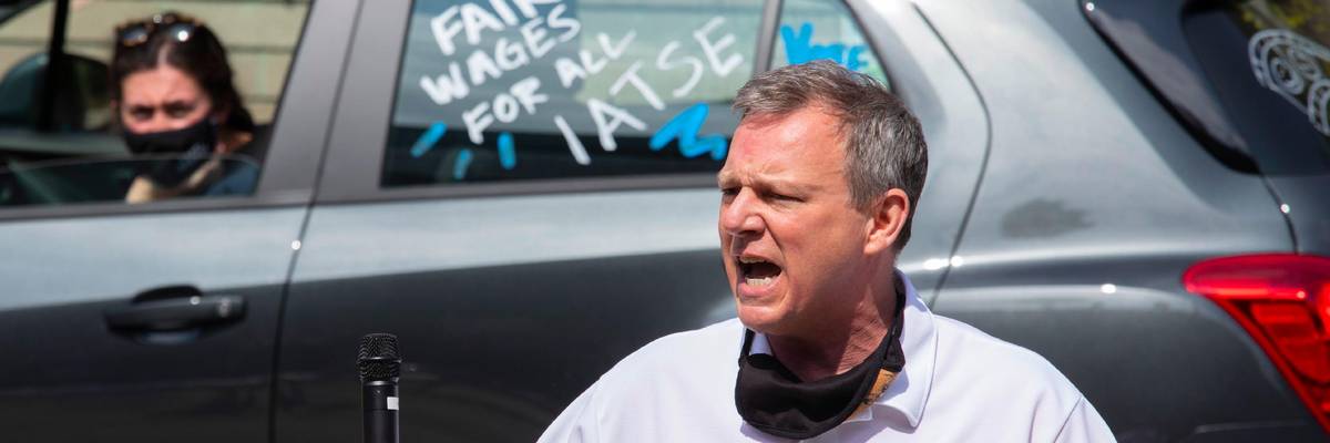 An IATSE organizer rallies workers.