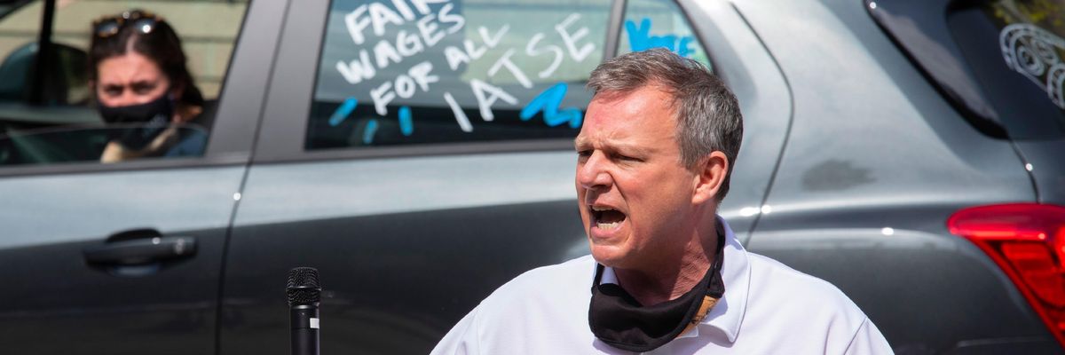 An IATSE organizer rallies workers.