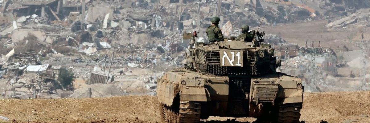 An IDF tank amid the ruins of Gaza