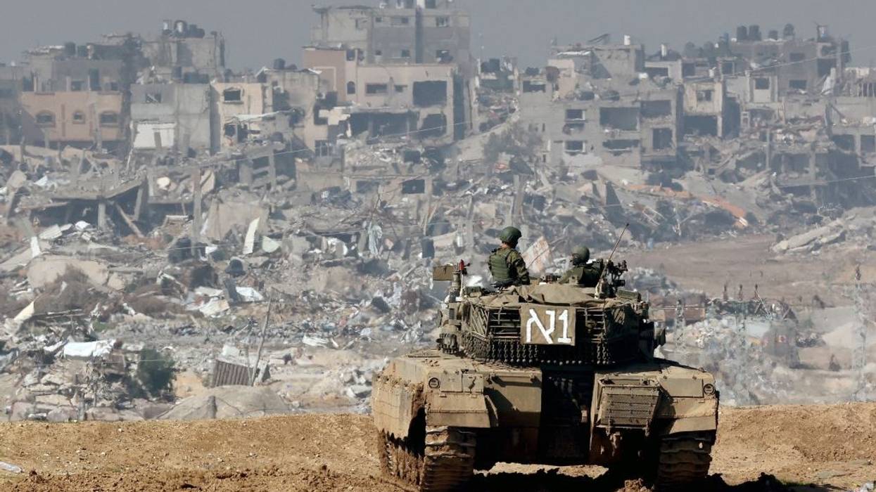 An IDF tank amid the ruins of Gaza