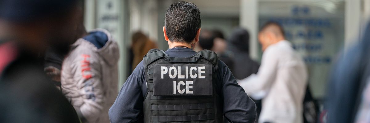 An Immigration and Customs Enforcement agent monitors