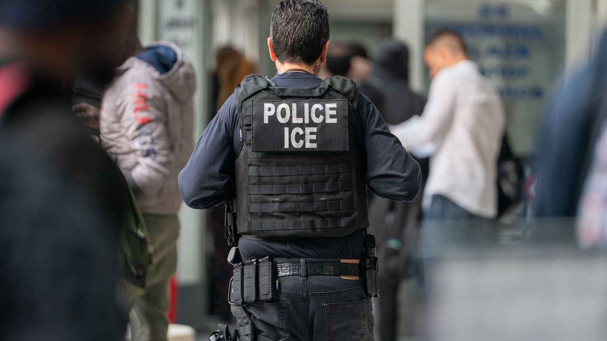 An Immigration and Customs Enforcement agent monitors