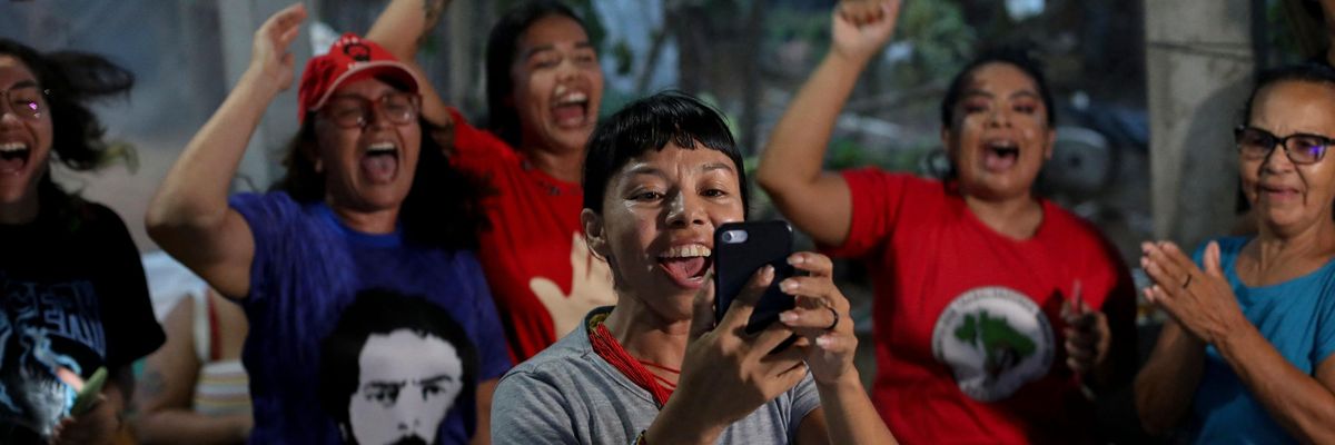 An Indigenous activist celebrates the victory of Lula