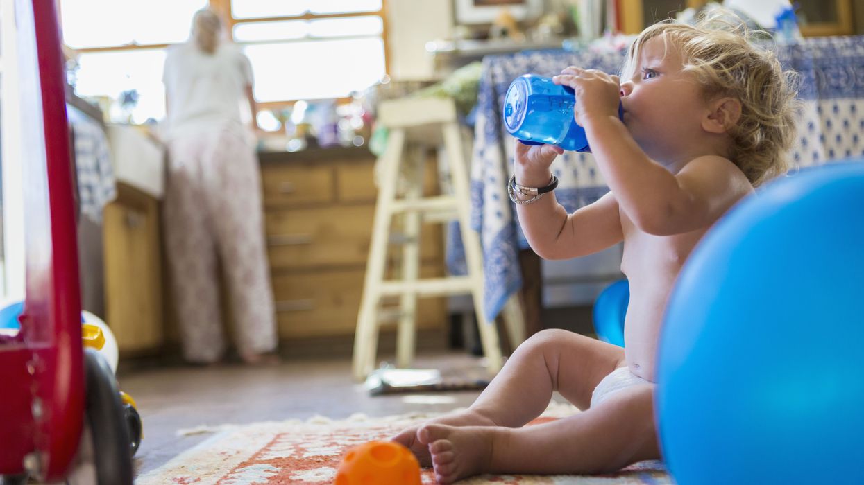 An infant drinks water
