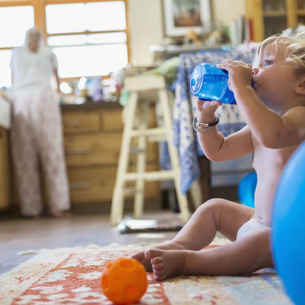 An infant drinks water