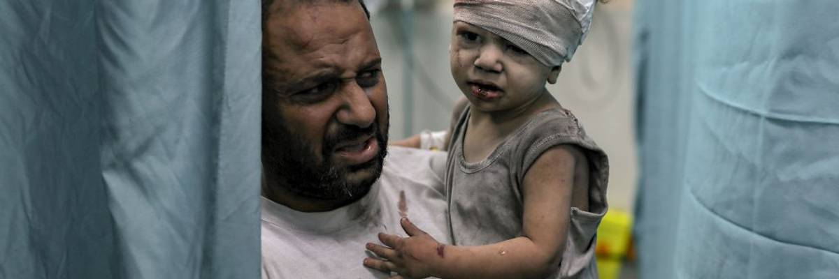 An injured child is brought to the Nassr hospital after the Israeli airstrikes in Khan Yunis, Gaza on October 19, 2023.