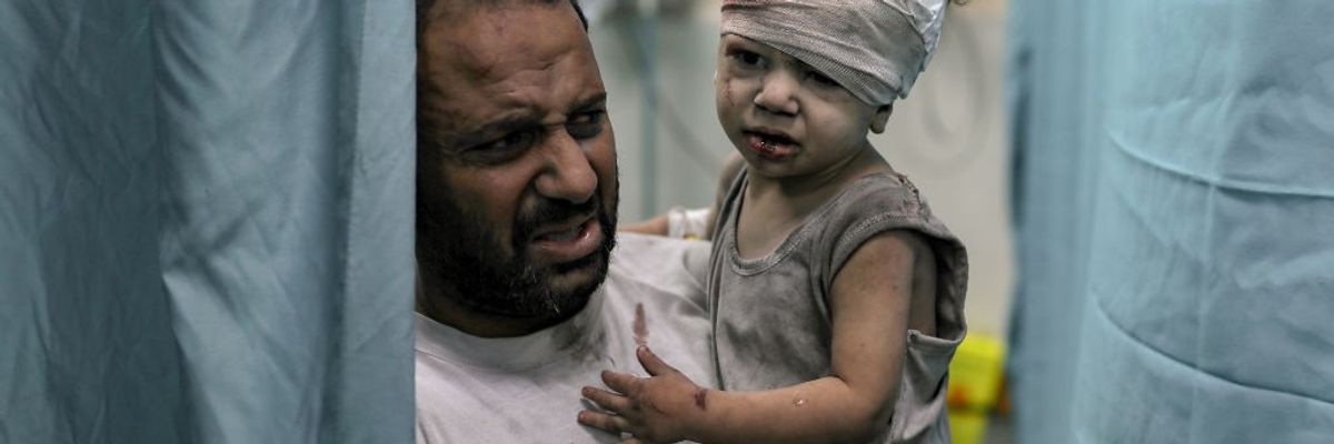 An injured child is brought to the Nassr hospital after the Israeli airstrikes in Khan Yunis, Gaza on October 19, 2023.