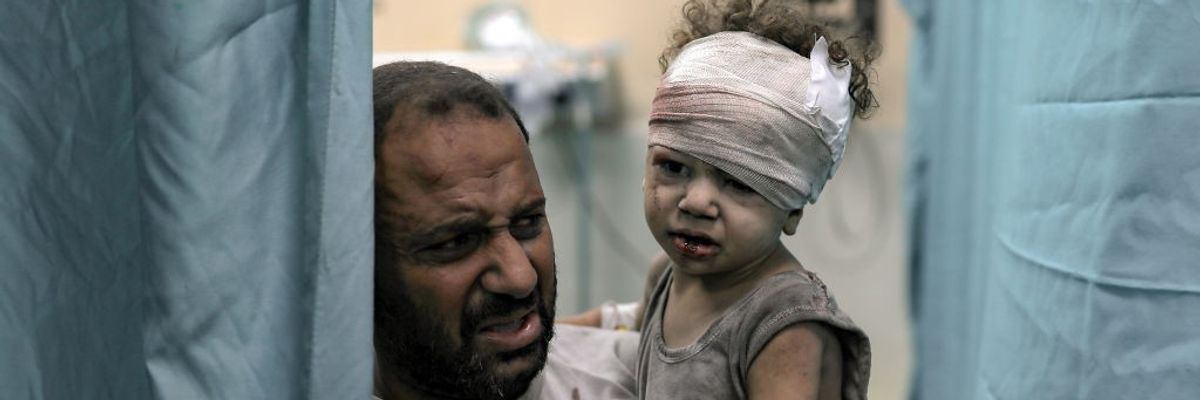 An injured child is brought to the Nassr hospital after the Israeli airstrikes in Khan Yunis, Gaza on October 19, 2023.