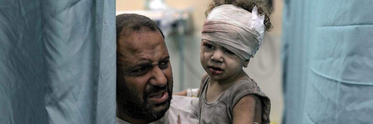 An injured child is brought to the Nassr hospital after the Israeli airstrikes in Khan Yunis, Gaza on October 19, 2023.