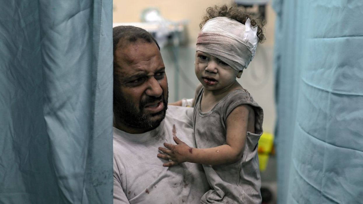 An injured child is brought to the Nassr hospital after the Israeli airstrikes in Khan Yunis, Gaza on October 19, 2023.