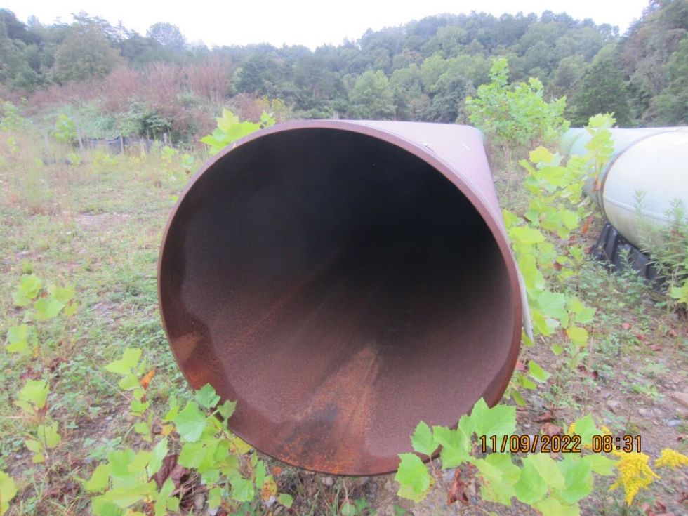 An interior of a rusty piece of pipeline.