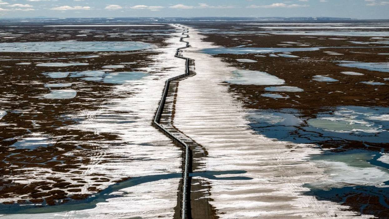 An oil pipeline stretches across the landscape outside Prudhoe Bay in North Slope Borough, Alaska on May 25, 2019.