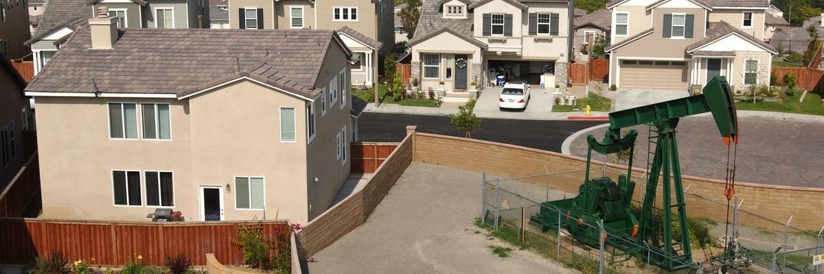 an oil well next to a house