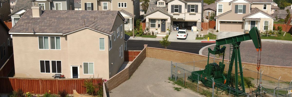 an oil well next to a house