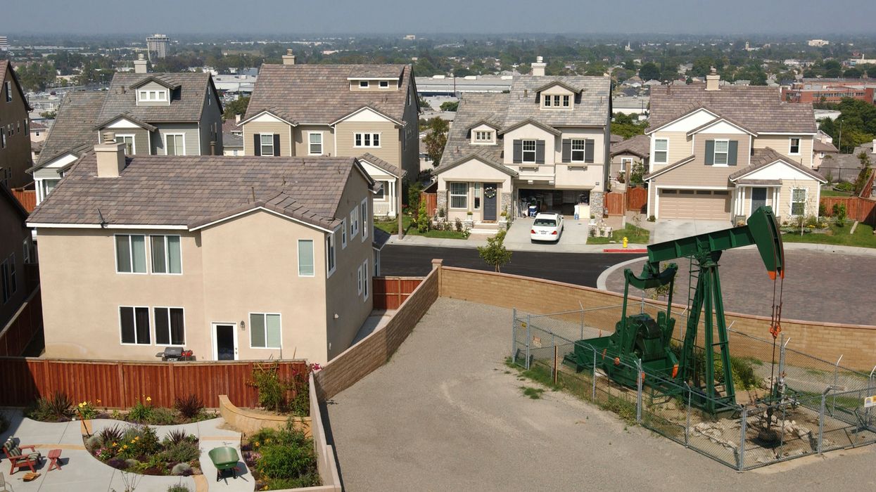 an oil well next to a house
