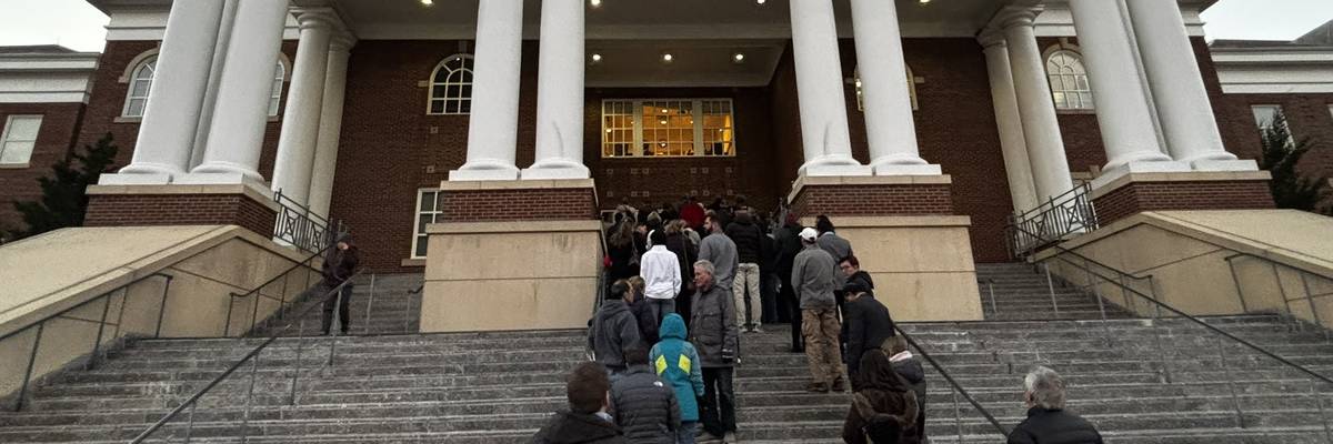 An overflow crowd spills outside the Roswell City Hall