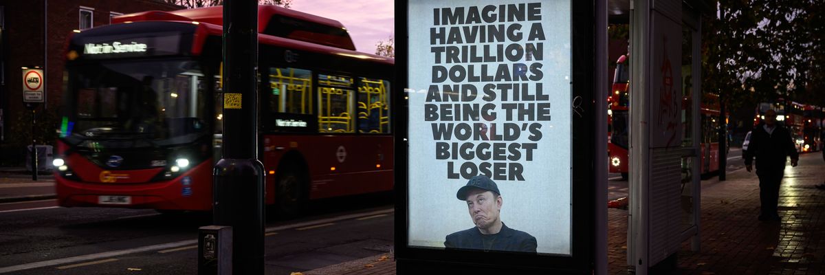 An unofficially installed poster that reads, "Imagine having a trillion dollars and still being the world's biggest loser,"