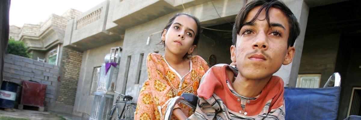 Anas Hamed (right) and his sister Inas are pictured on November 12, 2009 in Fallujah, Iraq, where birth defects have soared in the wake of the U.S. military's invasion.