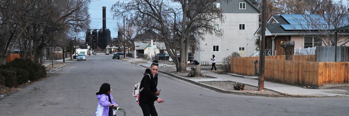 Angelic Herrera and her 11-year-old daughter, Xerih, walk home in Pueblo, Colorado