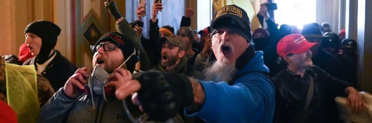Angry Trump supporters swarm through the halls of the U.S. Capitol on January 6, 2021.