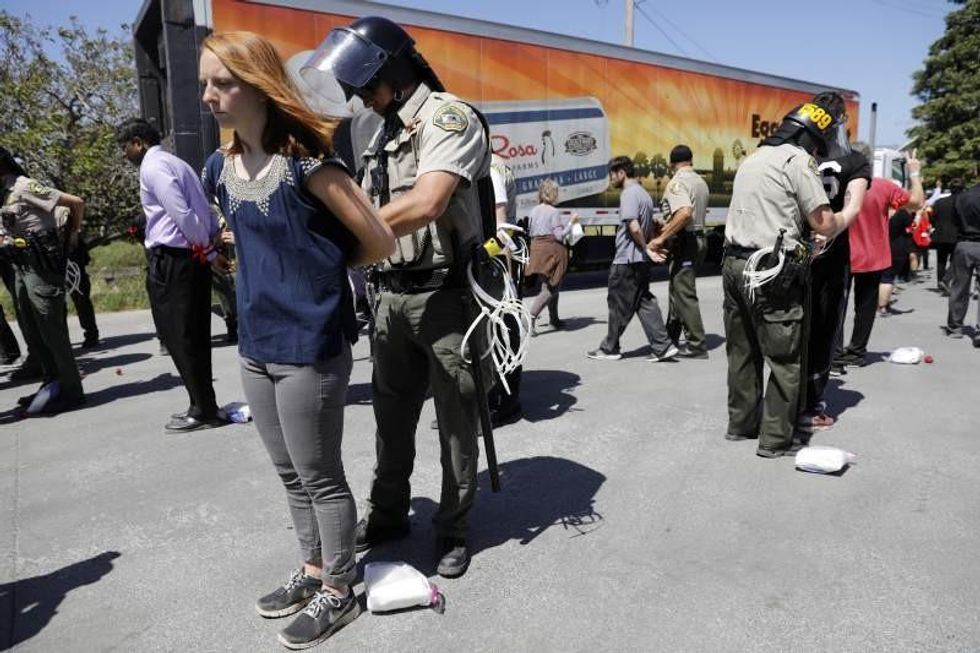 Animal rights activists arrested outside Sunrise Farms in Petaluma, California on Tuesday. (Photo: Beth Schlanker/Press Democrat)