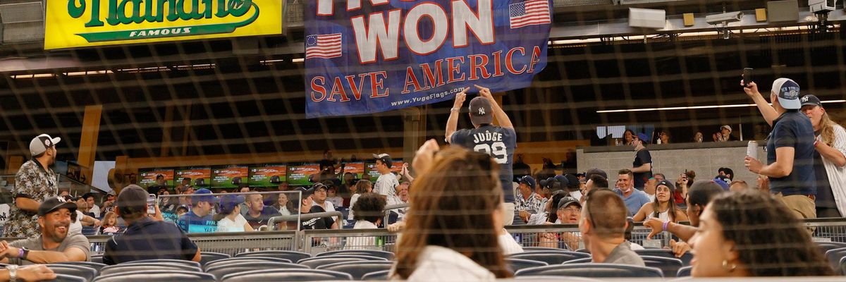 ans unroll a banner in support of former U.S. President Donald Trump during the fourth inning of Game Two of a doubleheader between the Toronto Blue Jays and the New York Yankees at Yankee Stadium on May 27, 2021 in the Bronx borough of New York City