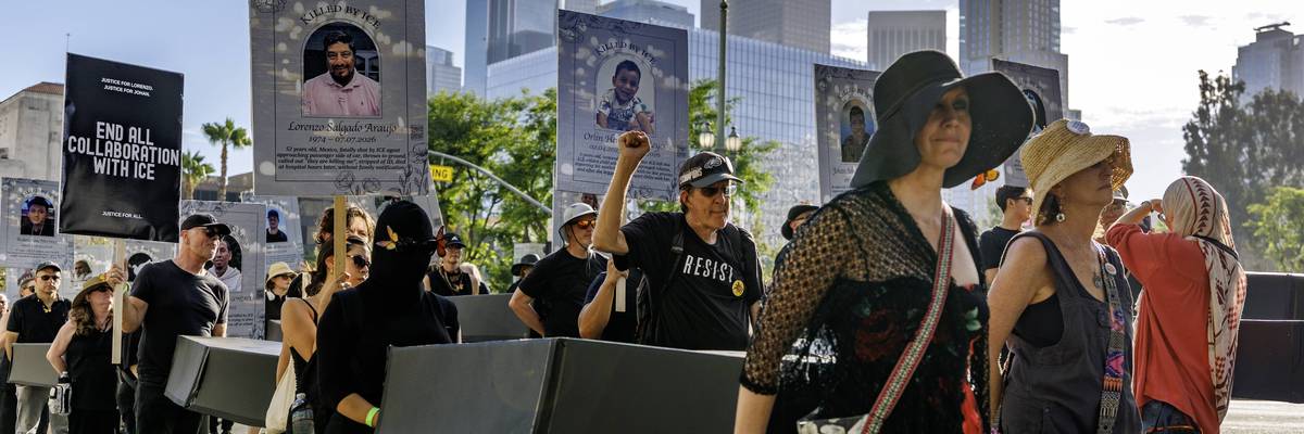 Anti-ICE protesters carry cardboard coffins in downtown Los Angeles