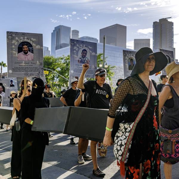 Anti-ICE protesters carry cardboard coffins in downtown Los Angeles