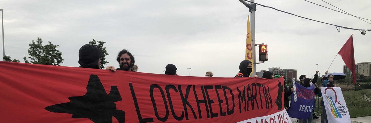Anti-war activists protest outside of CANSEC, North America's largest weapons fair, in Ottawa on June 1, 2022.