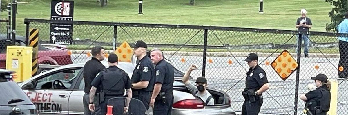 Anti-war demonstrators blockade a Raytheon facility