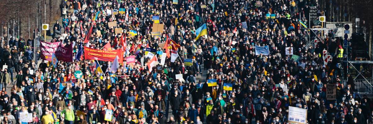 Anti-war demonstrators march in a Berlin street.