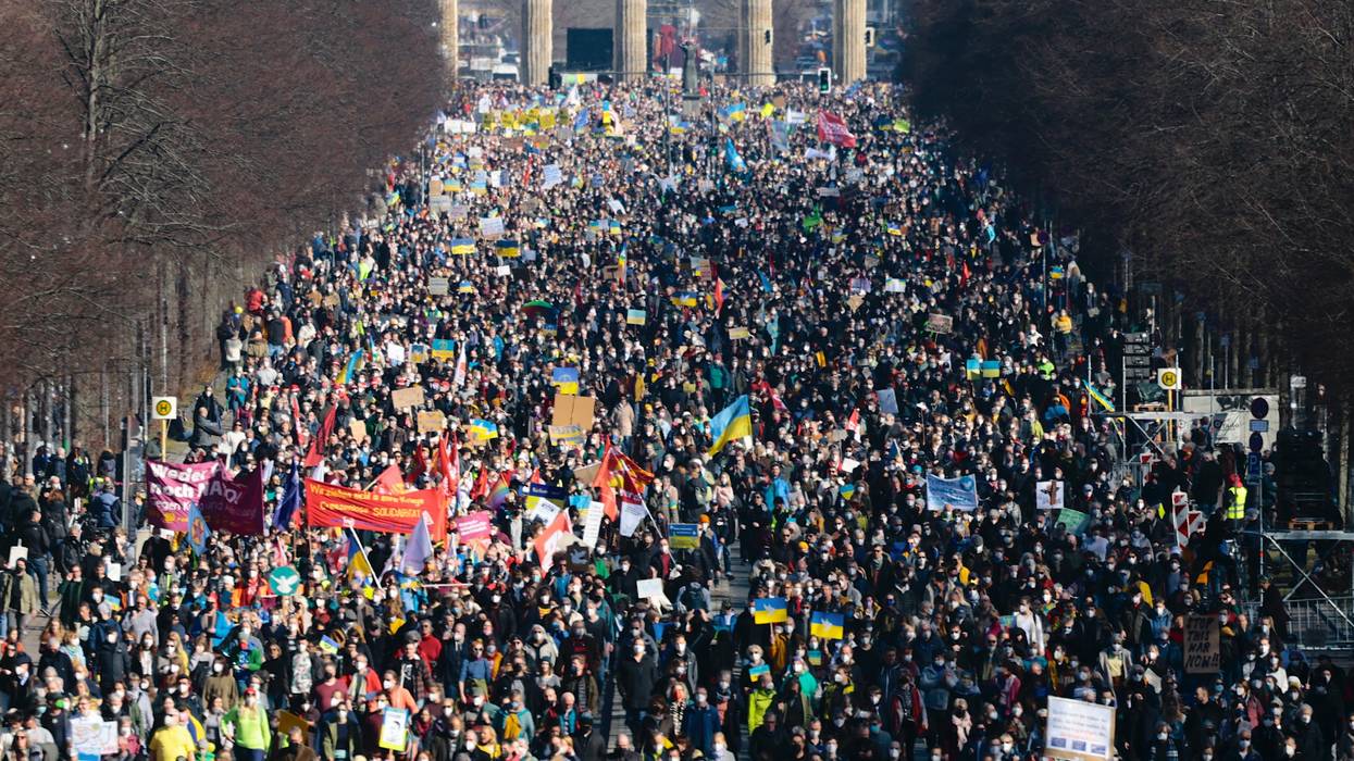 Anti-war demonstrators march in a Berlin street.