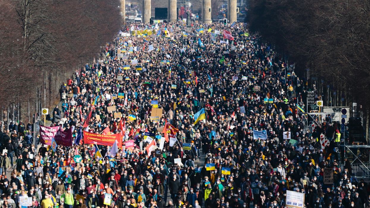 Anti-war demonstrators march in a Berlin street.