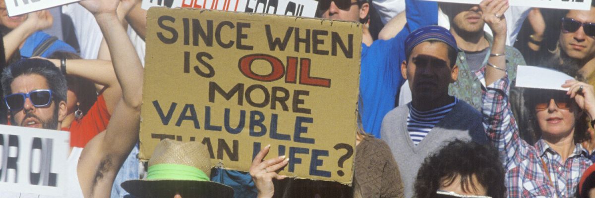 Antiwar protest with "No Blood for Oil" signs.