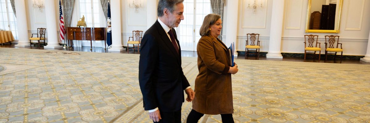 Antony Blinken walks with Victoria Nuland