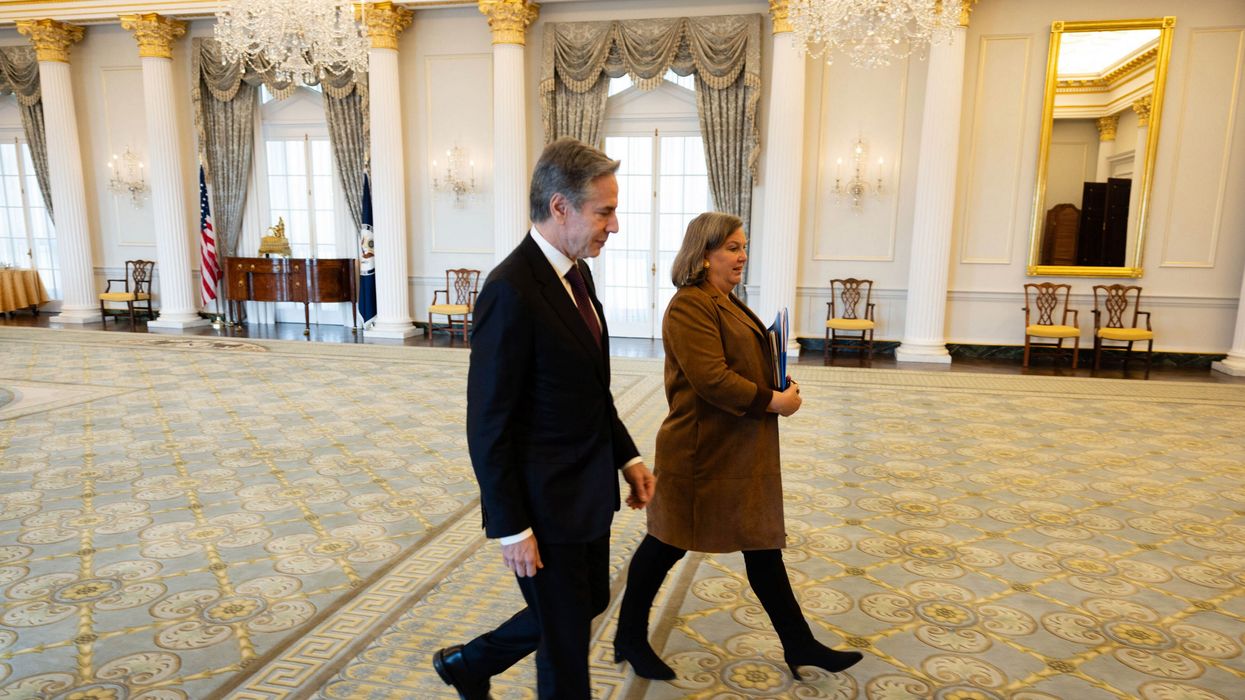 Antony Blinken walks with Victoria Nuland
