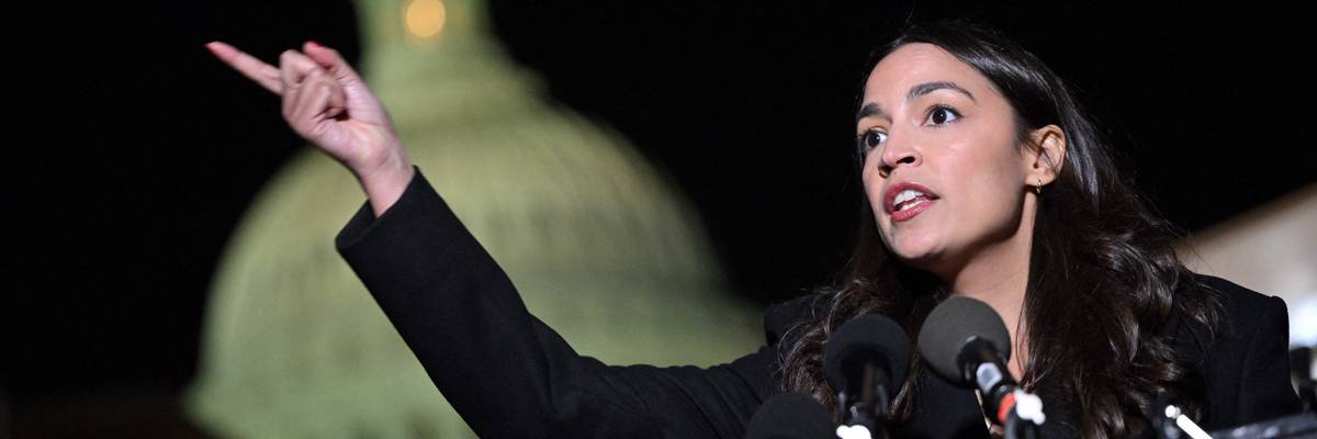 AOC speaks in front of the Capitol.