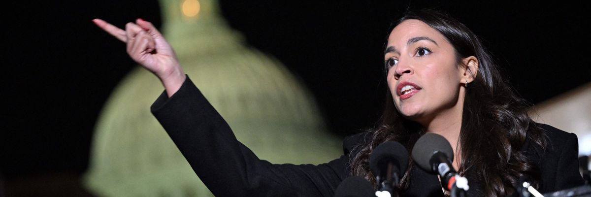 AOC speaks in front of the Capitol.
