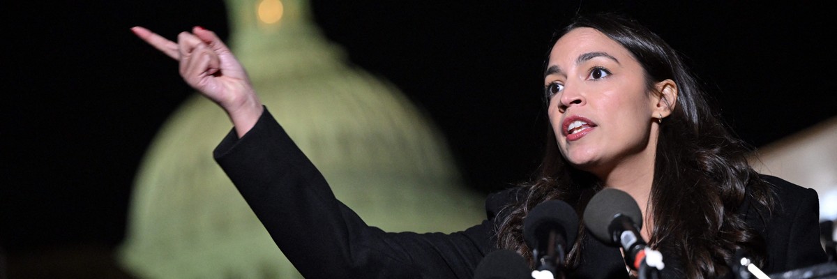 AOC speaks in front of the Capitol.