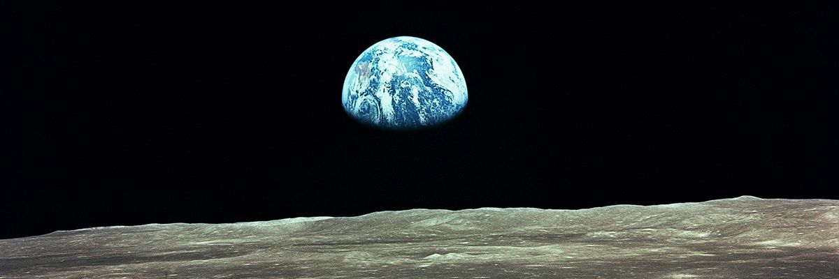 Apollo 11 Mission: view of the Earth risng over the Moon's horizon