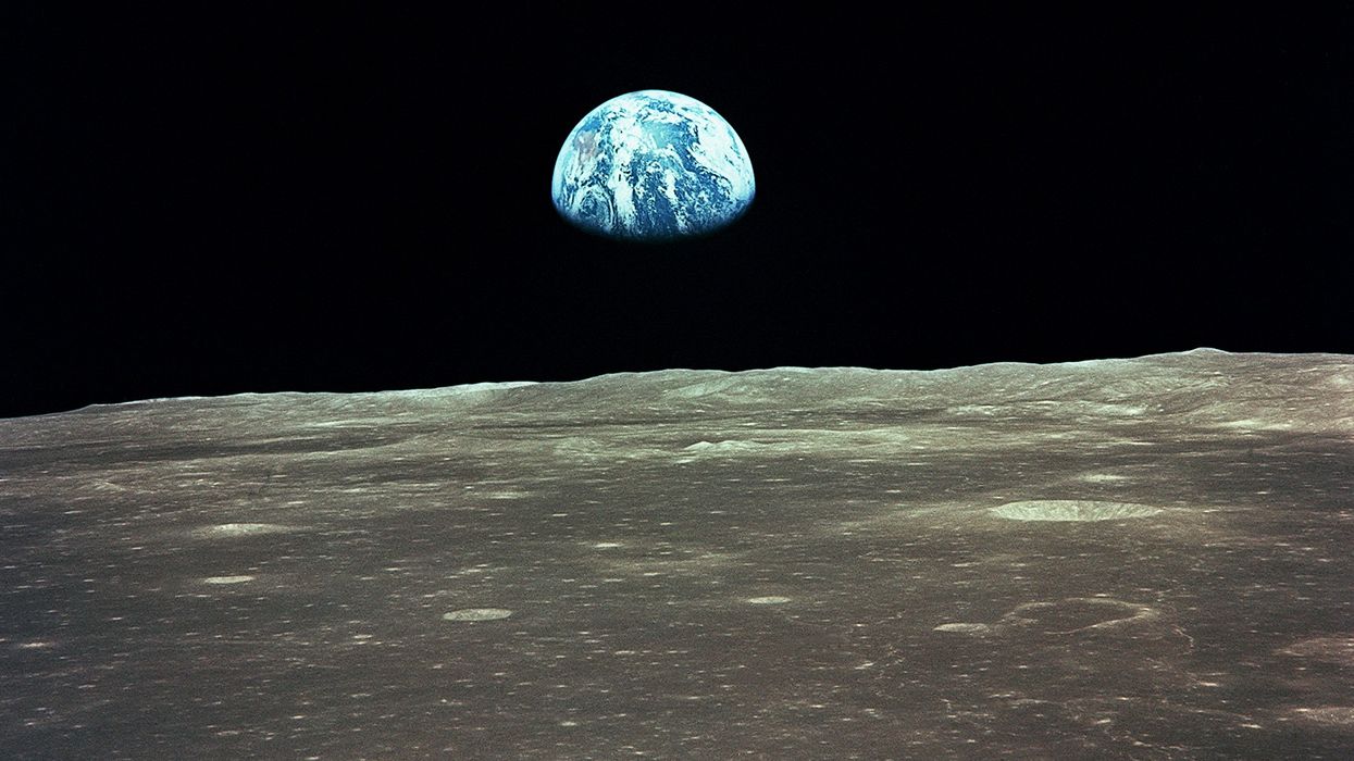 Apollo 11 Mission: view of the Earth risng over the Moon's horizon
