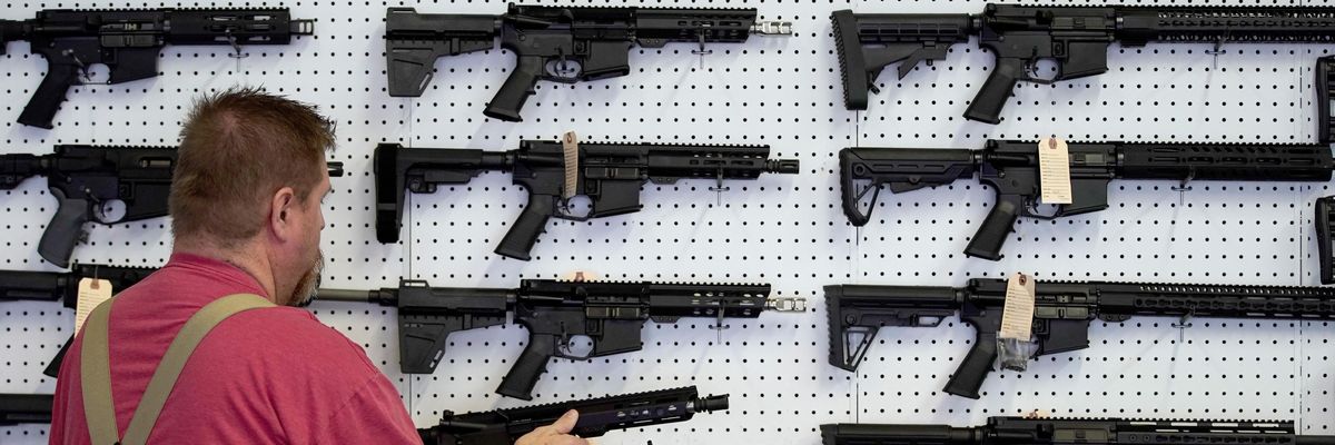 AR-15 assault rifles on display in a gun store
