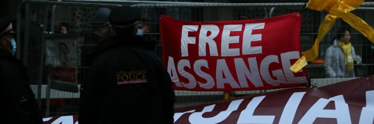 Assange supporters gather outside the court as the Julian Assange extradition verdict is delivered in London on January 4, 2020