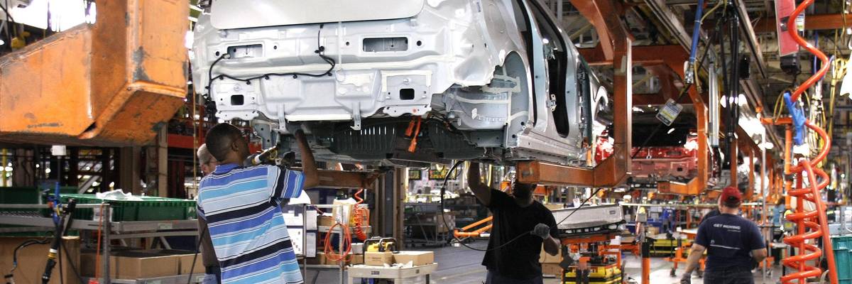 Assembly line workers assemble Chevy Volt electric vehicles and Opel Amperas at the General Motors Detroit Hamtramck Assembly Plant October 11, 2011 in Hamtramck, Michigan. Officials from the White House Council on Environmental Quality and the National Highway Traffic Safety Administration toured the plant today to highlight the Obama administrations fuel economy standards.