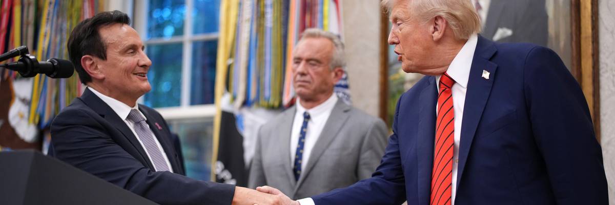 AstraZeneca CEO Pascal Soriot shakes hands with US President Donald Trump