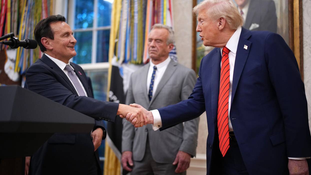 AstraZeneca CEO Pascal Soriot shakes hands with US President Donald Trump
