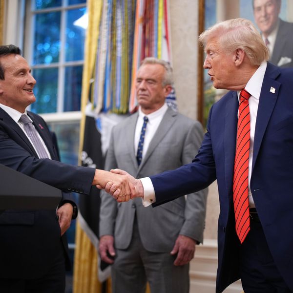 AstraZeneca CEO Pascal Soriot shakes hands with US President Donald Trump