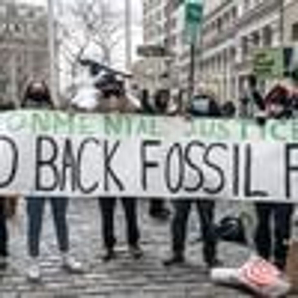 At a January 19, 2021 rally organized by Food & Water Watch, New York Communities for Change, and 350 NYC, environmental activists demand that the Biden administration Build Back Fossil Free in front of Charging Bull sculpture in New York City. (Photo: Lev Radin/Pacific Press/LightRocket via Getty Images)