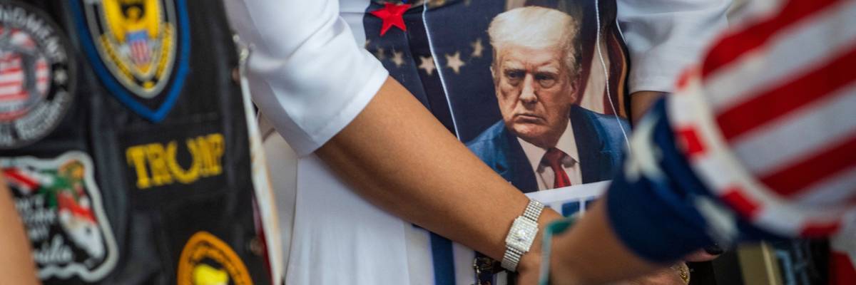 Attendees at this weekend's far-right CPAC show off their Trump paraphernalia.